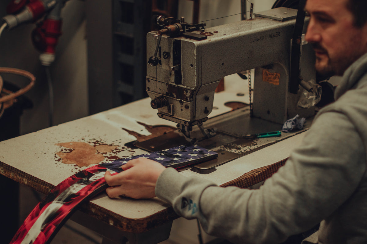 A belt being stitched at the sewing machine in the ModiFit workshop
